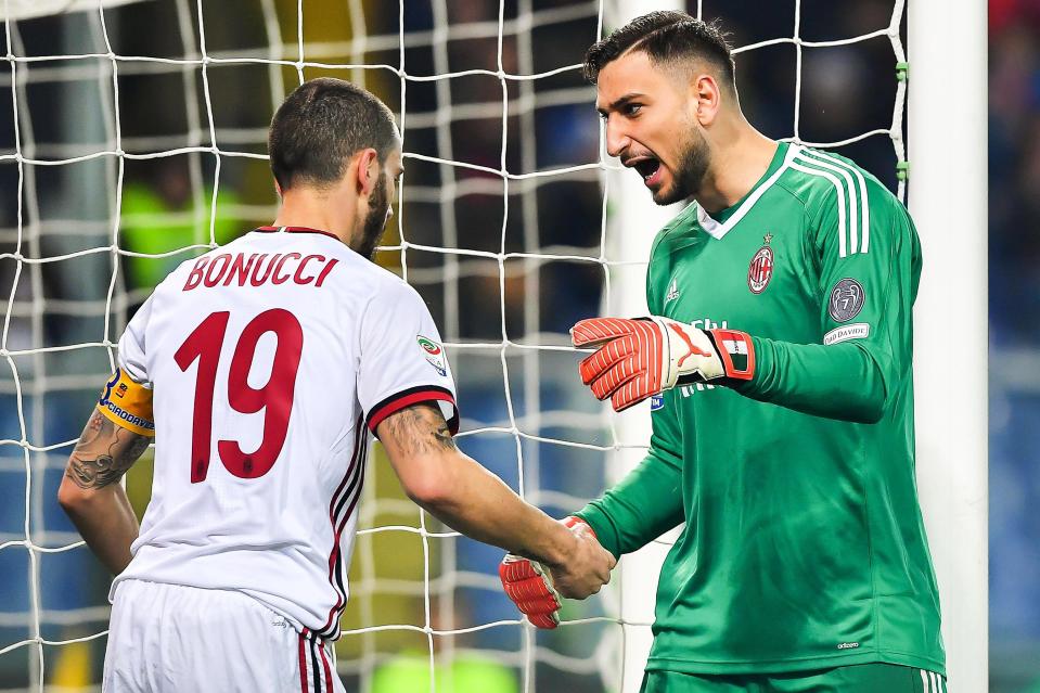 Genoa (Italy), 11/03/2018.- Milan’s defender Leonardo Bonucci (L) and goalkeeper Gianluigi Donnarumma (R) react