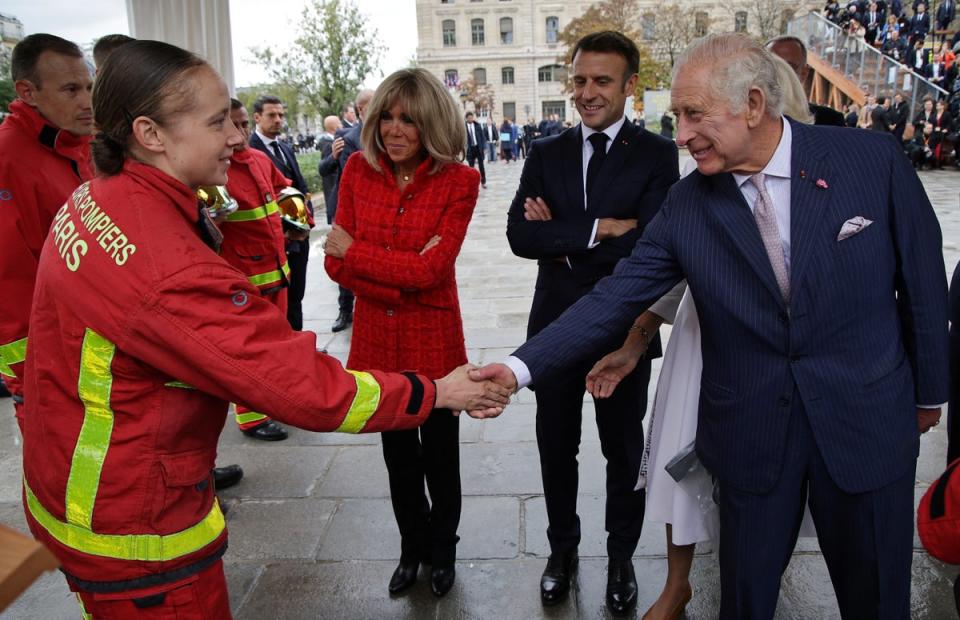 Charles, Camilla and the Macrons meet firefighters during a visit to the Notre-Dame Cathedral, which is undergoing a huge renovation after it was engulfed by a huge and devastating fire in 2019 (Reuters)