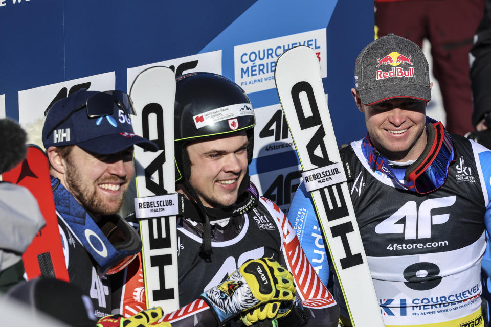 From left, Norway's Aleksander Aamodt Kilde, Canada's James Crawford and France's Alexis Pinturault pose in the finish area after completing an alpine ski, men's World Championship super-G race, in Courchevel, France, Thursday, Feb. 9, 2023. (AP Photo/Marco Trovati)