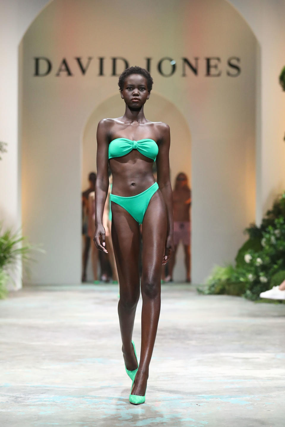 <p>Adelaide model Adut Akech, who has modeled for high fashion houses such as Chanel and Fendi, flashed her abs on the catwalk. Photo: Getty Images </p>