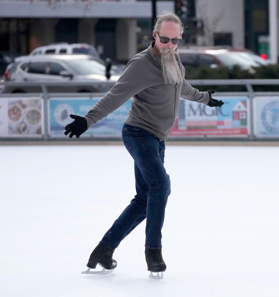 “It’s as close to flying as I’m ever gonna get,” said Dan Osterud, of Milwaukee, while figure skating at Red Arrow park in downtown Milwaukee on Tuesday, Jan. 24, 2023. The 52-year-old started skating 14 years ago when he picked up a pair of skates from a thrift store.
