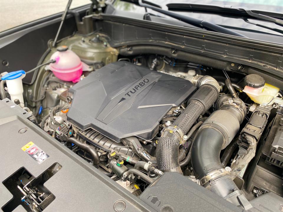 A 2.5 liter turbocharged four-cylinder engine in the engine compartment of a 2024 Hyundai Santa Fe XRT SUV.