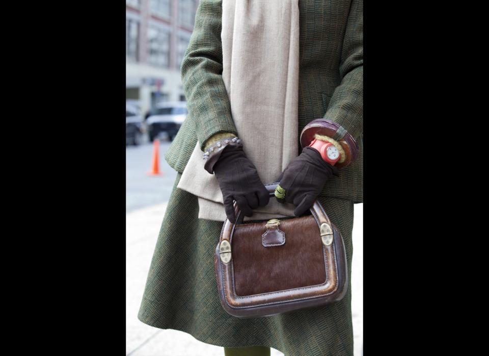 Rapoport believes that style can be healing. She love shopping for thrift finds, like this great bag she is carrying. Vintage accessories are the perfect addition to a chic suit.