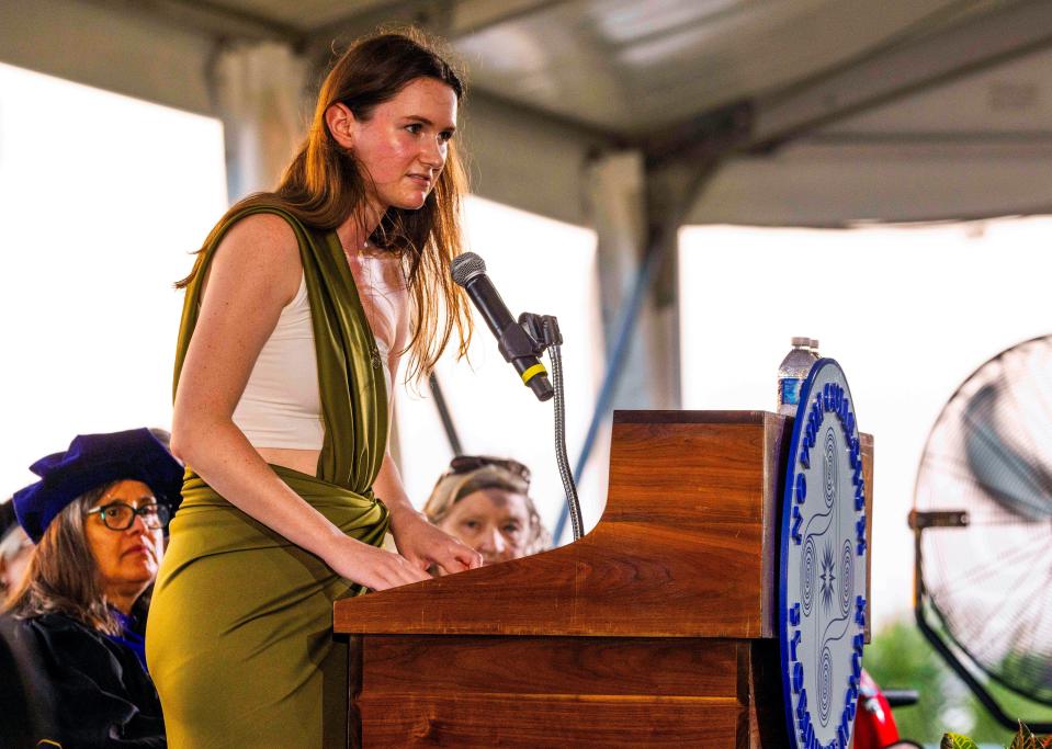 Grace Keenan, who served as New College of Florida's student body president and also a board trustee, speaks during the college's May 17, 2024, graduation ceremony on the grounds of College Hall.