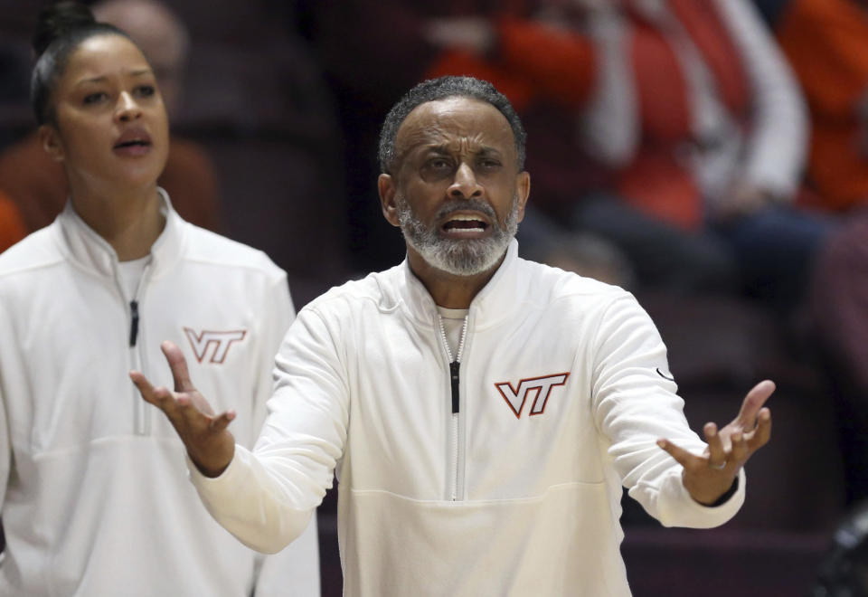 Virginia Tech coach Kenny Brooks gestures during the first half of the team's NCAA college basketball game against North Carolina State on Sunday, Feb. 19, 2023, in Blacksburg, Va. (Matt Gentry/The Roanoke Times via AP)
