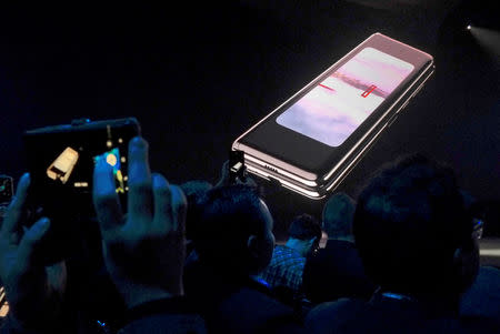 The Samsung Galaxy Fold phone is shown on a screen at Samsung Electronics Co Ltd’s Unpacked event in San Francisco, California, U.S., February 20, 2019 REUTERS/Stephen Nellis