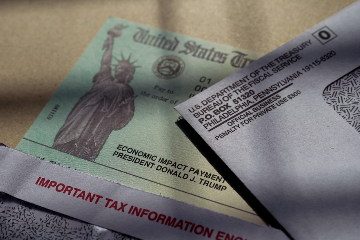 President Donald Trump's name is seen on a stimulus check issued by the IRS to help combat the adverse economic effects of the COVID-19 outbreak, in San Antonio, Thursday, Jan. 28, 2021, in San Antonio. (AP Photo/Eric Gay)