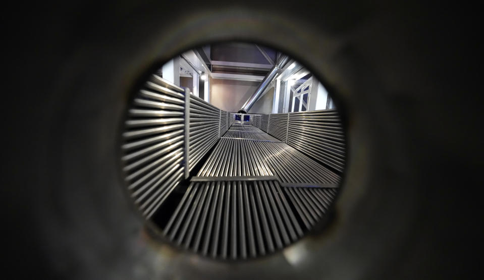 A cross-section of a prototype reactor is shown inside Last Energy's microreactor demonstration unit Tuesday, Jan. 17, 2023, in Brookshire, Texas. For the company's CEO, Bret Kugelmass, the urgency of the climate crisis means zero-carbon nuclear energy must be scaled up soon. (AP Photo/David J. Phillip)