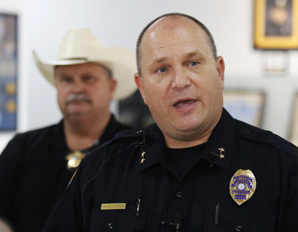 Odessa Police Chief Michael Gerke talks to the media in the Odessa Police Department in Odessa, Texas, Saturday, Aug. 31, 2019, following a shooting at random in the area of Odessa and Midland. Several people were dead after a gunman who hijacked a postal service vehicle in West Texas shot more than 20 people, authorities said Saturday. The gunman was killed and a few law enforcement officers were among the injured. (Mark Rogers/Odessa American via AP)