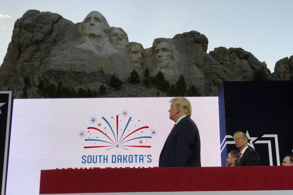 President Donald Trump stands on stage before he speaks at the Mount Rushmore National Monument Friday, July 3, 2020, in Keystone, S.D. (AP Photo/Alex Brandon)