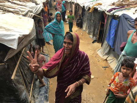 Bangladeshi farmer Jorina Katun gestures among the Rohingya Muslims camped out on her land near the Kutapalong refugee camp in the Cox's Bazar district of Bangladesh February 9, 2018. Picture taken February 9, 2018. REUTERS/Andrew RC Marshall