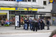 Security forces are seen after a knife attack in a supermarket in Hamburg. REUTERS/Morris Mac Matzen