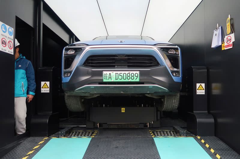 FILE PHOTO: Nio ES8 electric SUV changing its battery is seen inside a power station at a JAC Motors-NIO plant in Hefei