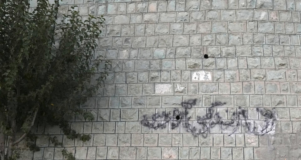 A graffiti which reads in Farsi: "Woman Life Freedom" the key slogan of anti-government protests after the death of 22-year-old woman Mahsa Amini in the September 2022, while in the custody of the country's morality police, for wearing her hijab too loosely, is written on the wall of a park in Tehran, Iran, Monday, Sept. 11, 2023. (AP Photo/Vahid Salemi)