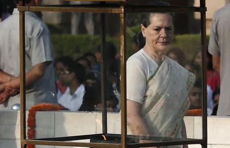 Congress Party chief Sonia Gandhi walks after paying homage at the Mahatma Gandhi memorial on the 145th birth anniversary of Mahatma Gandhi at Rajghat in New Delhi October 2, 2014. REUTERS/Adnan Abidi/Files