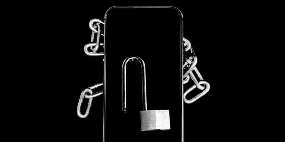 closeup of padlock with chain over black background