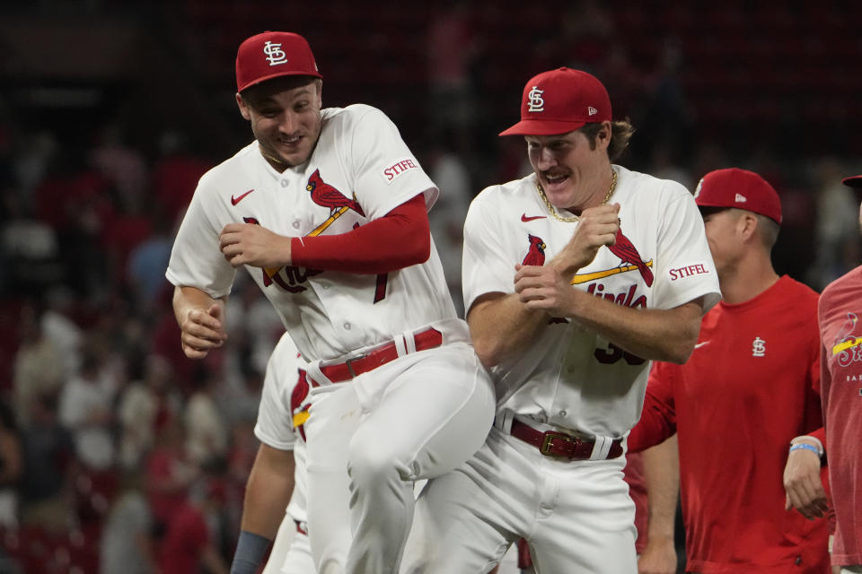 St. Louis Cardinals starting pitcher Miles Mikolas, right, celebrates with teammate Andrew Knizner following a 2-1 victory over the Kansas City Royals in a baseball game Tuesday, May 30, 2023, in St. Louis. (AP Photo/Jeff Roberson)