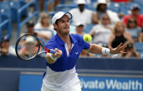 Andy Murray, of Britain, returns a shot against Richard Gasquet, of France, during first-round play at the Western & Southern Open tennis tournament Monday, Aug. 12, 2019, in Mason, Ohio. (AP Photo/Gary Landers)