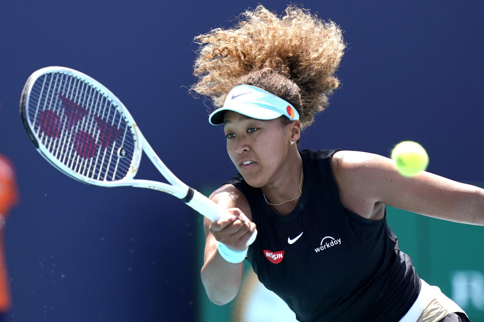 Naomi Osaka, of Japan, returns to Maria Sakkari, of Greece, during the quarterfinals of the Miami Open tennis tournament, Wednesday, March 31, 2021, in Miami Gardens, Fla. Sakkari won 6-0, 6-4. (AP Photo/Lynne Sladky)