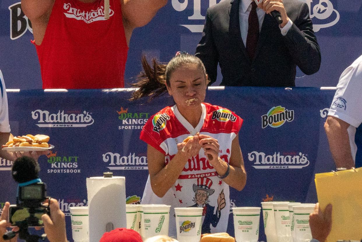 Competitive eating champion Michelle Lesco wins the women's 2021 Nathan's Famous 4th Of July International Hot Dog Eating Contest with 31 hot dogs at Coney Island on July 4, 2021 in New York City.