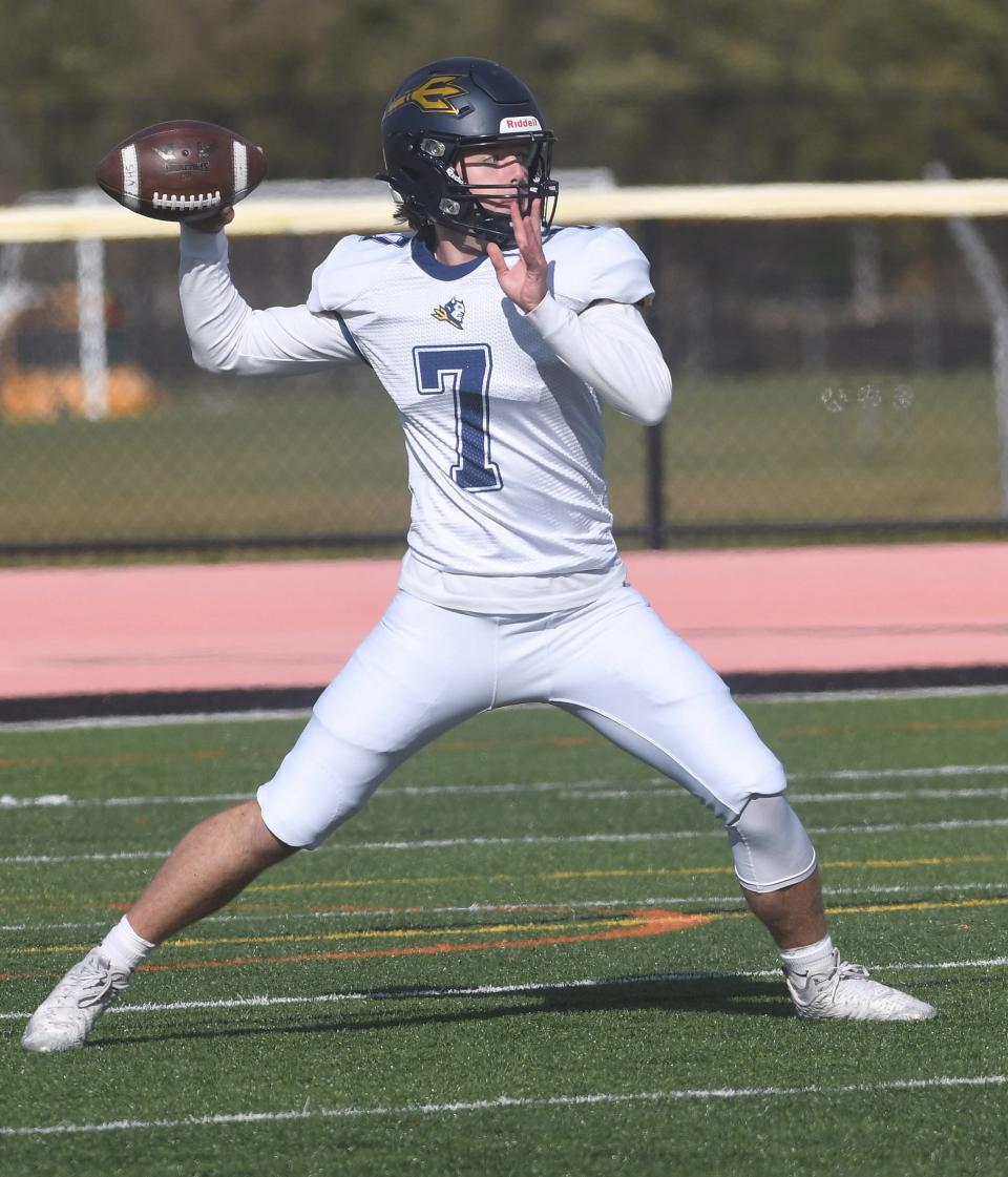 Victor quarterback Jacob Loughlin fires a pass in the second half.