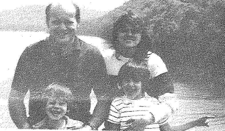 Frank and Janet Shuglie posing for a photo with sons Josh and Christopher.