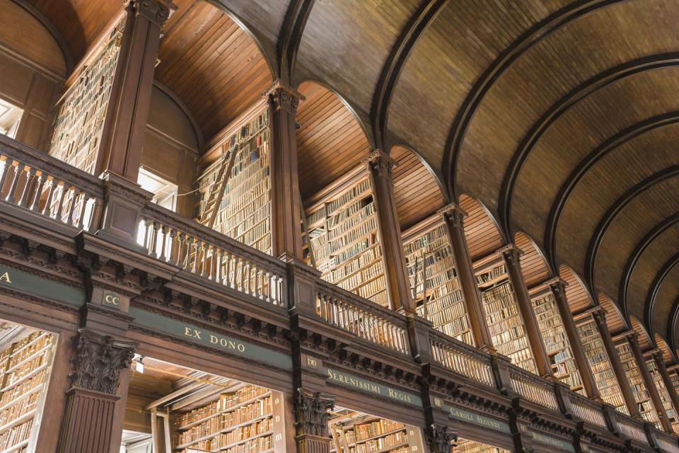 <p>The main building of this college library, known as the Old Library, was designed by Irish architect Thomas Burgh in 1712 and includes the Long room, pictured, a breathtaking expanse of arched bookshelves beneath a vaulted ceiling. This room alone houses 200,000 volumes. </p>