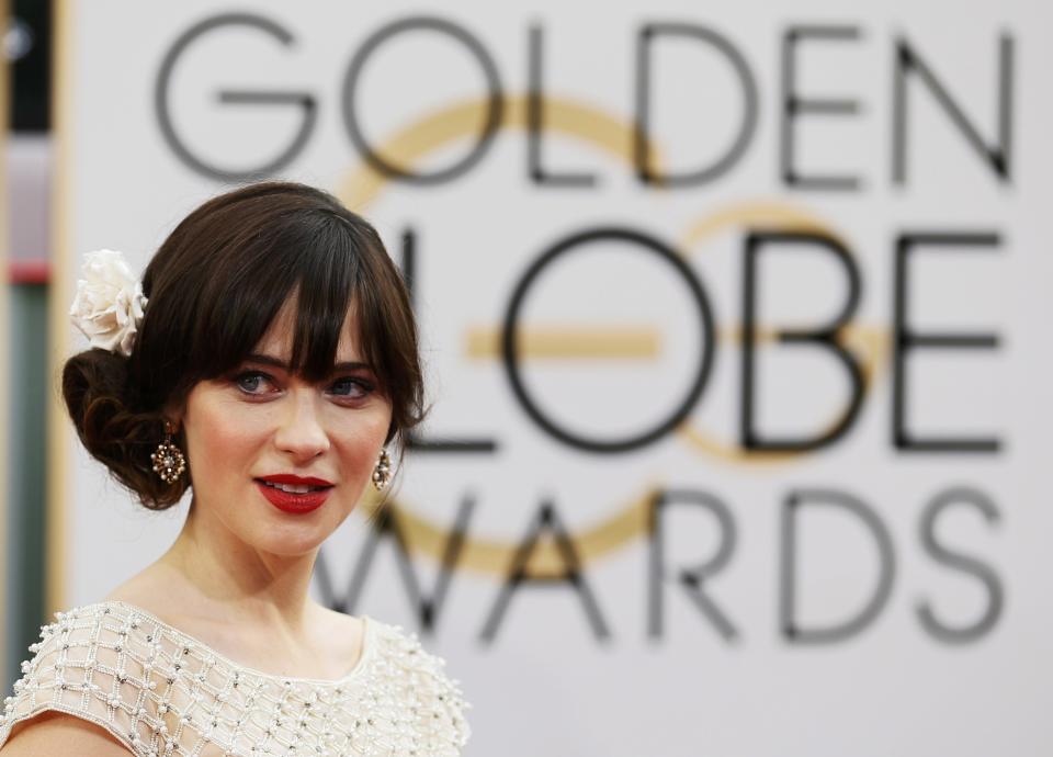 Zooey Deschanel arrives at the 71st annual Golden Globe Awards in Beverly Hills