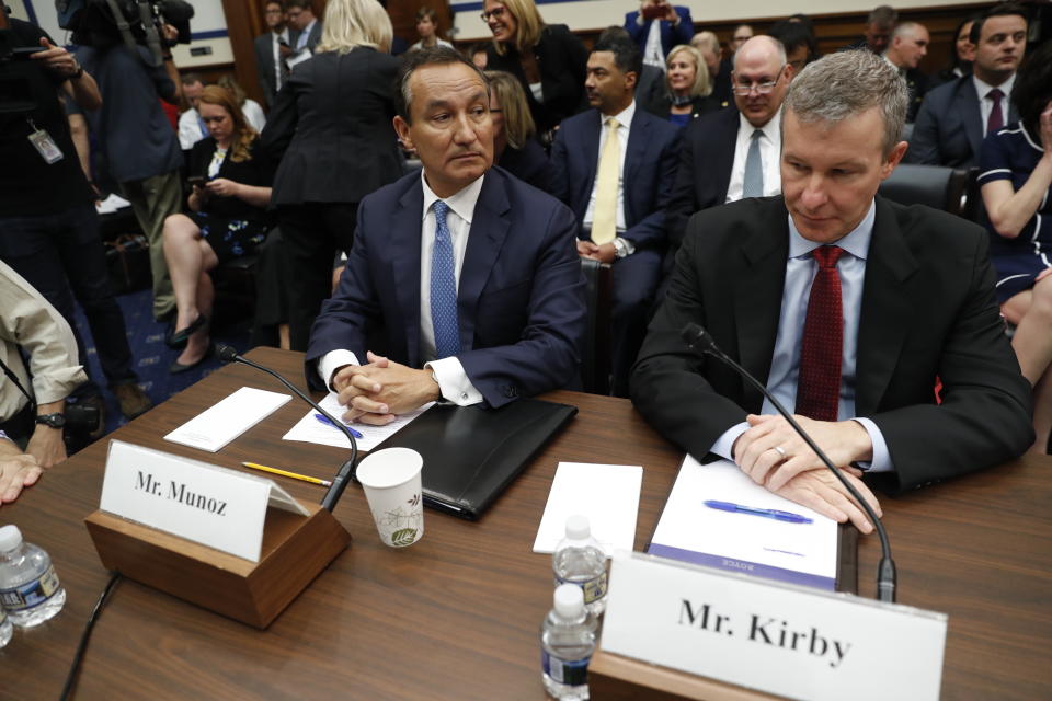 FILE - In this May 2, 2017, file photo United Airlines CEO Oscar Munoz, left, and United Airlines President Scott Kirby, prepare to testify on Capitol Hill in Washington to testify before a House Transportation Committee oversight hearing. United Airlines CEO Munoz is stepping down from his post and will become executive chairman. The airline said Thursday, Dec. 5, 2019, that Kirby will be its new CEO. (AP Photo/Pablo Martinez Monsivais, File)