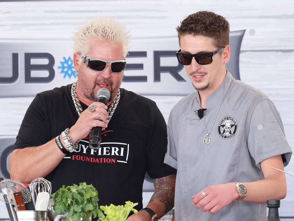 Guy Fieri and his son Chef Hunter Fieri are seen during the South Beach Wine and Food Festival on February 26, 2022 in Miami Beach, Florida