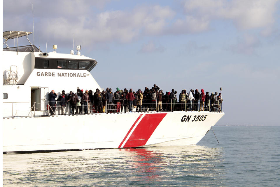 Migrants board a vessel after getting stopped by Tunisian Maritime National Guard at sea during an attempt to get to Italy, near the coast of Sfax, Tunisia, Tuesday, April 18, 2023. The Associated Press, on a recent overnight expedition with the National Guard, witnessed migrants pleading to continue their journeys to Italy in unseaworthy vessels, some taking on water. Over 14 hours, 372 people were plucked from their fragile boats. (AP Photo)