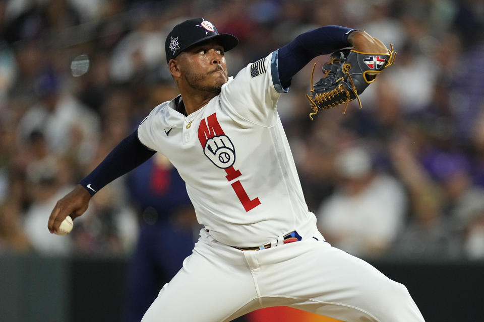 National League's Freddy Peralta, of the Milwaukee Brewers throws during the sixth inning of the MLB All-Star baseball game, Tuesday, July 13, 2021, in Denver. (AP Photo/Jack Dempsey)