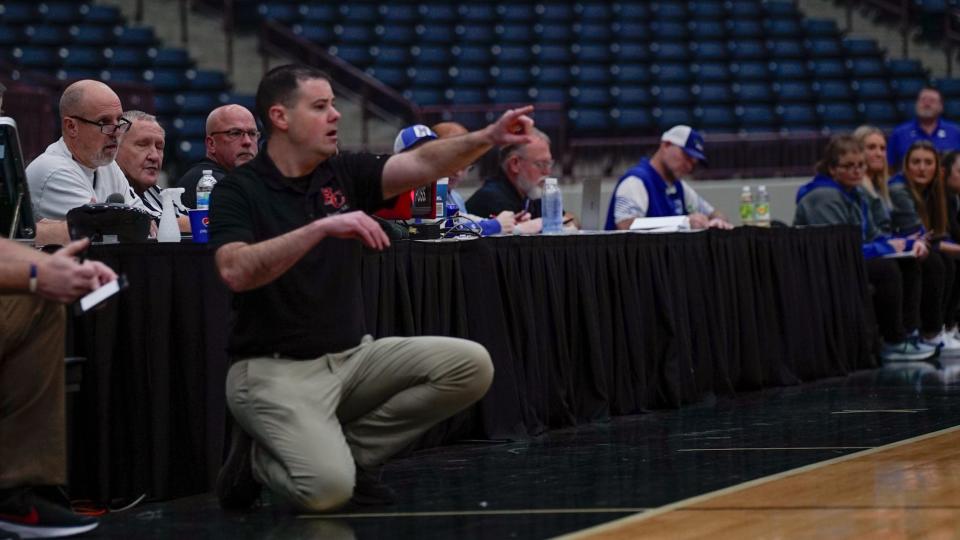 Holy Cross head coach Ted Arlinghaus gives his team an offensive play call during the second half of the Indians' All 'A' semifinal game on Jan. 27 at Corbin Arena in Corbin, Ky.