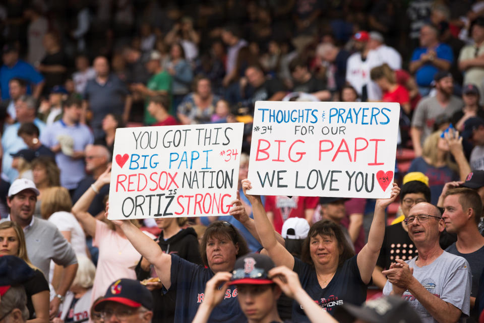 BOSTON, MA - JUNE 10: Fans hold up signs showing support for former Red Sox player David Ortiz prior to the start of the game against the Texas Rangers at Fenway Park on June 10, 2019 in Boston, Massachusetts. Ortiz was shot in the back while at a club in the Dominican Republic. He underwent surgery and the Red Sox are transporting him back to Boston. (Photo by Kathryn Riley /Getty Images)