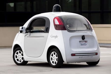 Journalists take a test drive in a prototype of Google's own self-driving vehicle during a media preview of Google's current autonomous vehicles in Mountain View, California September 29, 2015. REUTERS/Elijah Nouvelage