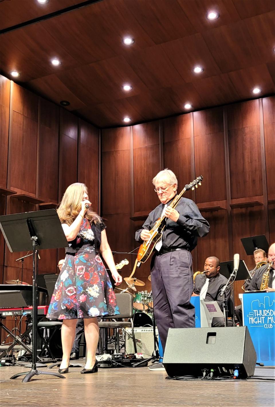 Lisa Foltz, one of TNMC's talented vocalists, performs while  Dr. Patrick Dunnigan, the band's Music Director, accompanies on guitar. The ensemble will present its 14th annual Jazz Showcase at 7:30 p.m. on Thursday, Aug. 11, 2022.