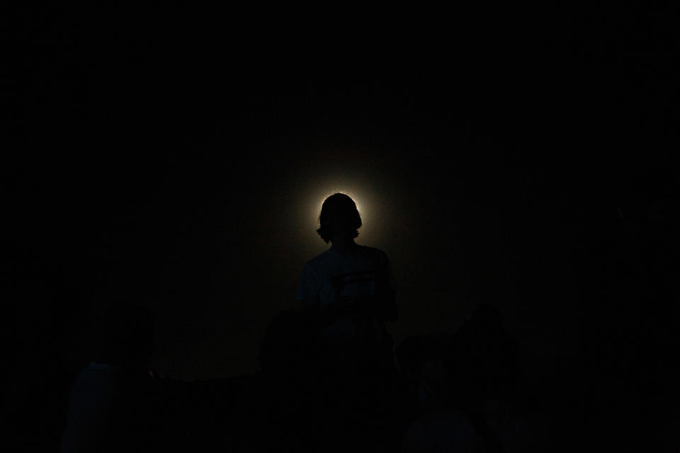 A person's silhouette against a light