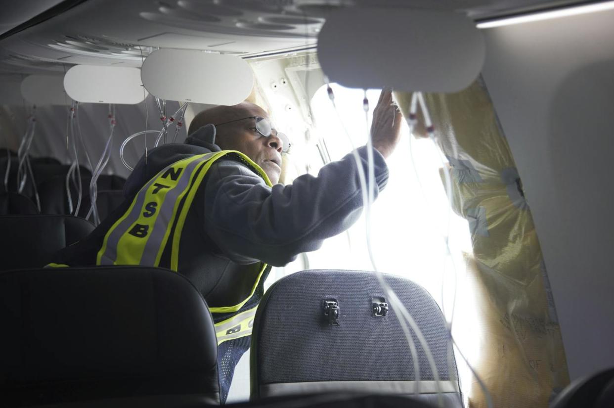 An investigator examines the frame of a Boeing aircraft whose door plug blew out in flight. <a href="https://newsroom.ap.org/detail/BoeingEmergencyLanding/390bb7248d0f4069b1b987492afbc254/photo" rel="nofollow noopener" target="_blank" data-ylk="slk:National Transportation Safety Board via AP;elm:context_link;itc:0;sec:content-canvas" class="link ">National Transportation Safety Board via AP</a>