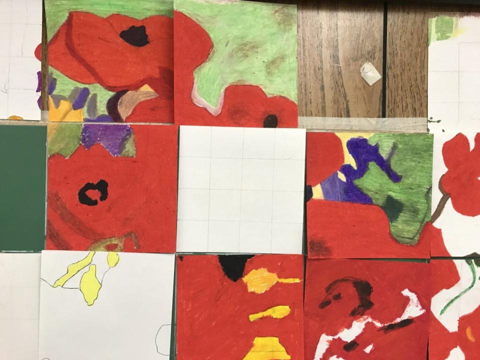 A mosaic of oil pastel drawings made by seventh and eighth graders in East Holmes schools is put together to create the final version of a Vincent Van Gogh piece called 'Poppies,' said Art teacher Kristine Flinner.
