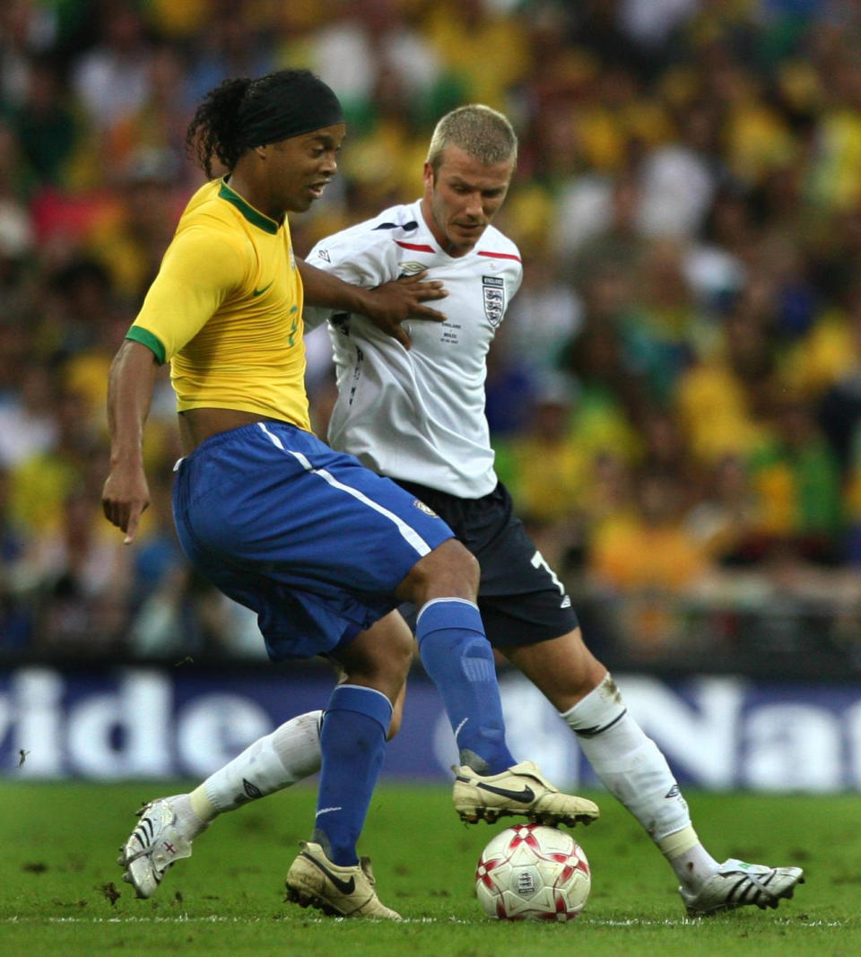 Brazil's Ronaldinho holds the ball away from England's David Beckham, during a friendly International at Wembley Stadium.