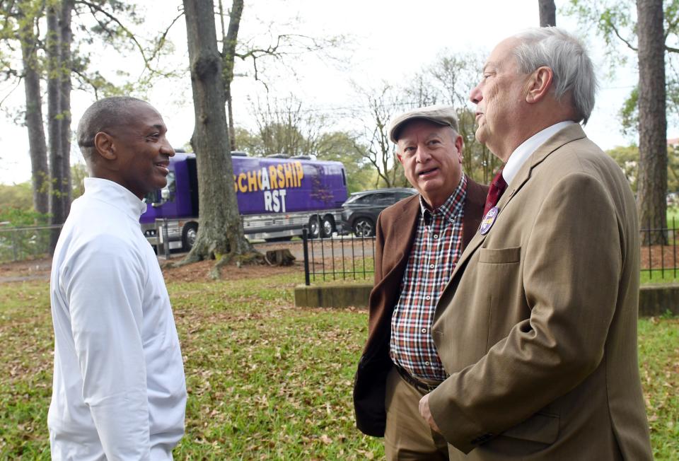 LSU President William Tate (left) talks with local historians Mike Tudor and Michael Wynne at the original site where LSU was founded in Pineville as the Louisiana State Seminary of Learning and Military Academy in 1860. The stop was part of the LSU Scholarship First bus tour.