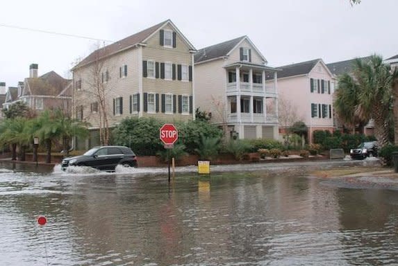 Tidal flooding, also known as sunny day flooding or nuisance flooding, inundates the streets of Charleston, South Carolina. NOAA said the United States' East and West coasts experienced record high tide flooding last year as El Niño is forecast to bring more through 2024. Photo courtesy of NOAA