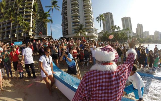 hawaiian santa in canoe