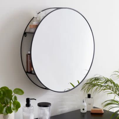 Pick a mirror like this one that has handy hidden shelves