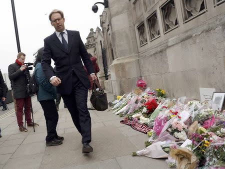 British Member of Parliament Tobias Ellwood walks past floral tributes as he arrives at the Houses of Parliament, following a recent attack in Westminster, London, Britain March 24, 2017. REUTERS/Darren Staples