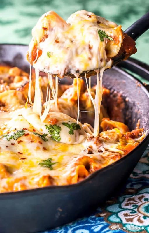 <p>Flavor Mosaic</p><p>Lasagna can be a bit of a cooking project but this recipe takes a much-needed shortcuts by using quick-cooking tortellini as the pasta base. </p><p><strong>Get the recipe: <a href="https://flavormosaic.com/cheesy-tortellini-skillet-lasagna/" rel="nofollow noopener" target="_blank" data-ylk="slk:Cheesy Tortellini Skillet Lasagna;elm:context_link;itc:0;sec:content-canvas" class="link ">Cheesy Tortellini Skillet Lasagna</a></strong></p>