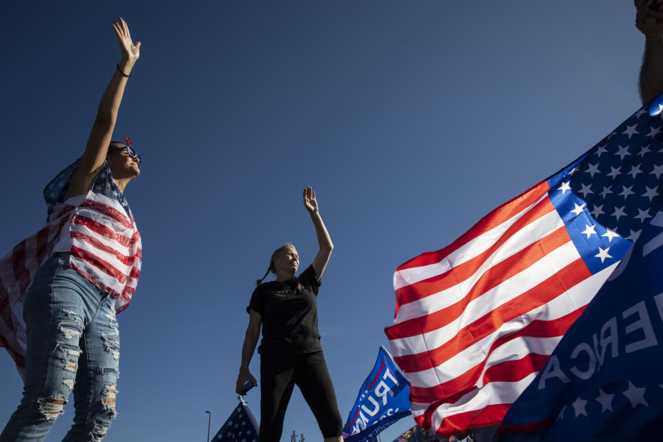 Supporters of President Donald Trump attend a rally, Saturday, Aug. 29, 2020 in Clackamas, Ore. (AP Photo/Paula Bronstein)