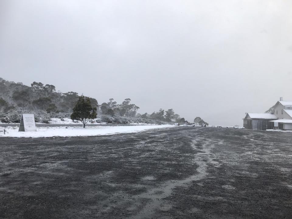 Snow is seen outside Great Lake General Store in Miena, Tasmania.
