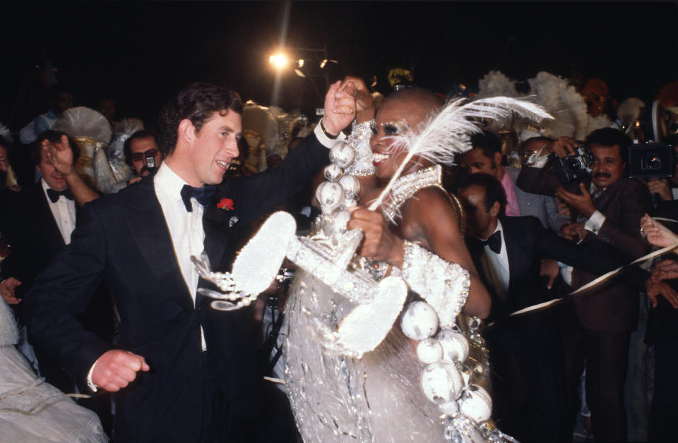 RIO DE JANEIRO, BRAZIL - 1978: Prince Charles, Prince of Wales dances with a Samba dancer at a party at the Town Hall in 1978 in Rio de Janeiro, Brazil. (Photo by Anwar Hussein/Getty Images)