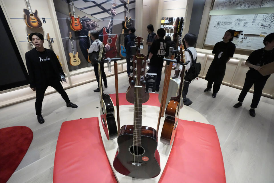 Fender guitars are on display at the opening ceremony of Fender's Tokyo store Thursday, June 29, 2023. Fender, the guitar of choice for some of the world’s biggest stars from Jimi Hendrix to Eric Clapton, is opening what it calls its “first flagship store” in its 77-year history. (AP Photo/Eugene Hoshiko)